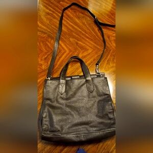 New with tag brown faux leather purse.